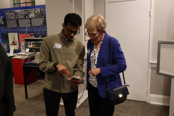 A picture of graduate student, Meet Patel, and alumni board member, Donna Geuser chatting.
