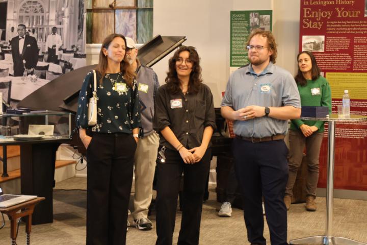 A picture of Dr. Catherine Linnen, Sophia Novoa, and Jakeb Watts. Drs. Pete Mirabito and Elizabeth Duncan are in the background.