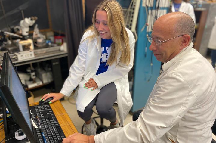 UK student Kaitlyn Brock and Professor Robin Cooper work together in a research lab.