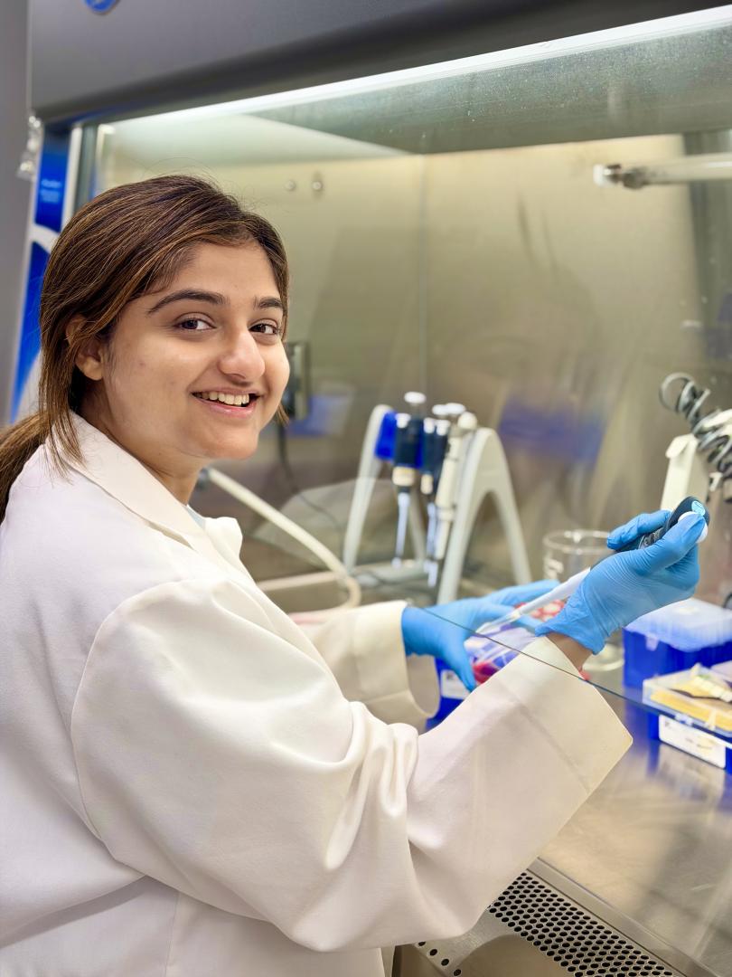 A picture of Sajina Dhungel working in the lab.