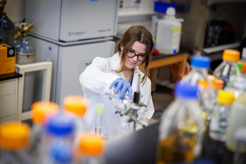 A photo of graduate student, Sarah Stasel, working in the lab.